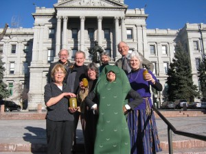 WCC members and staff bring pickles to the steps of the Capital in Denver (front): Evette Lee, Gretchen Nicholoff, Emily Hornback, Betsy Leonard: (back) Marv Ballantyne, Mac Tiger-Tolle, Monica Wiitanen, Rein van West.